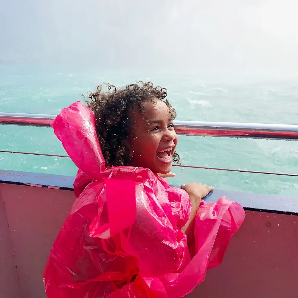 Laughing child enjoying Niagara cruise experience