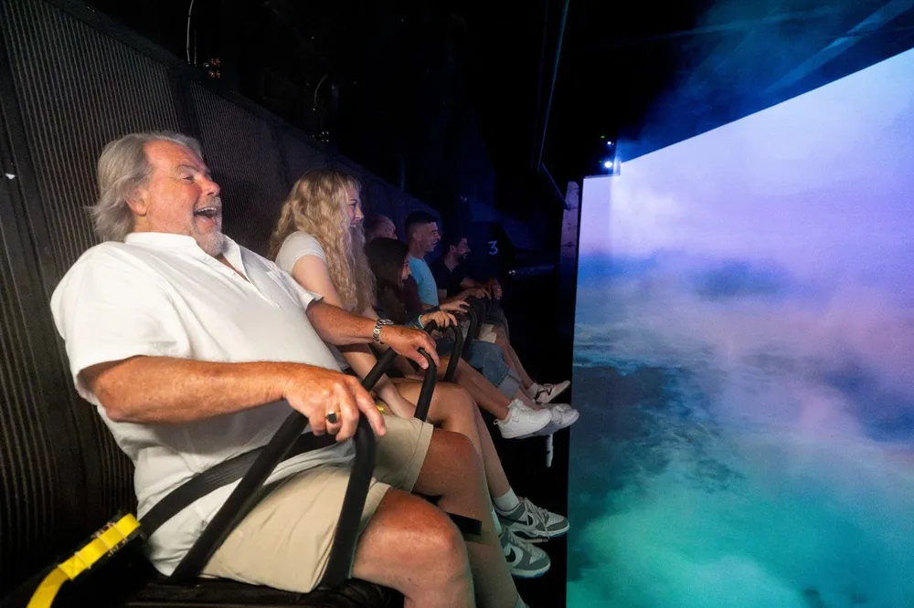 Laughing guests experiencing Niagara Takes Flight immersive ride
