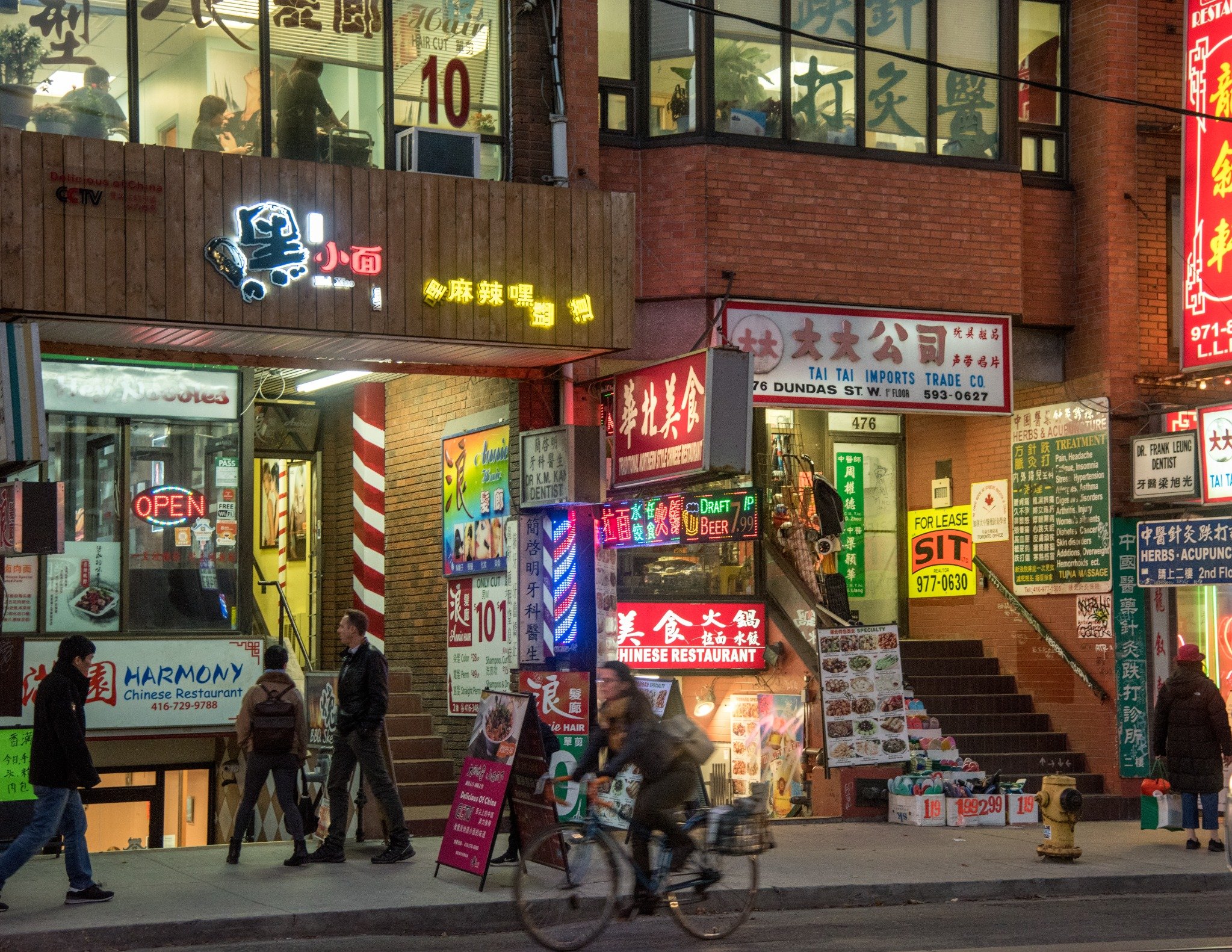 Vibrant Chinatown streets at night with colorful signs and lights