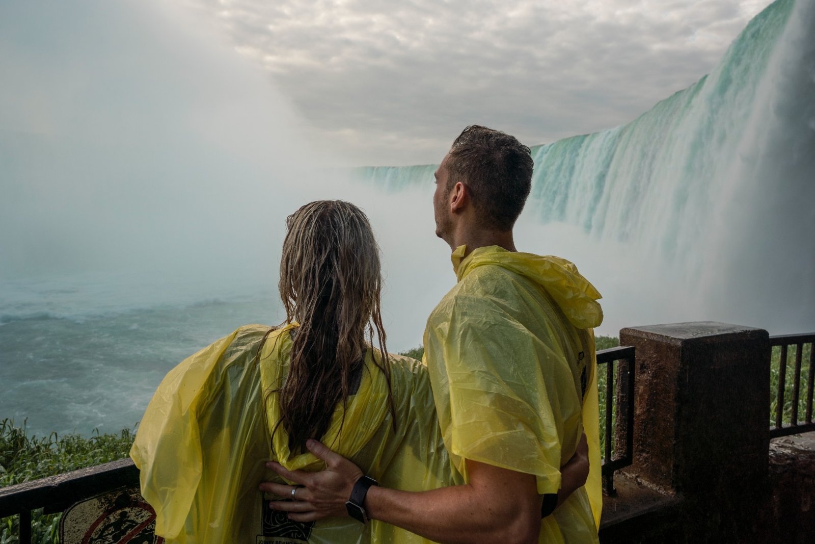 Couple watching Horseshoe Falls together in a romantic moment