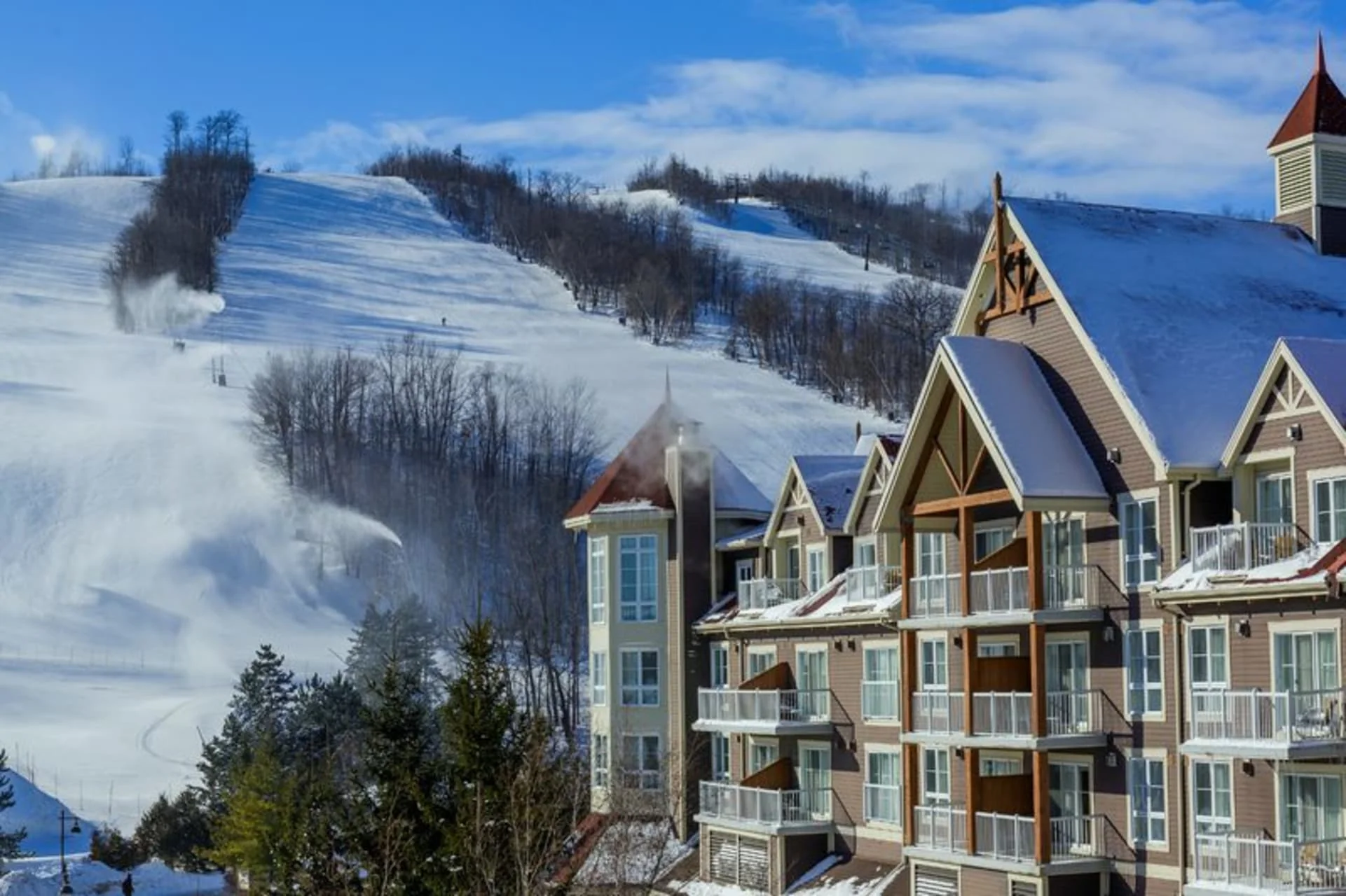 Blue Mountain Resort exterior with ski slopes during daytime