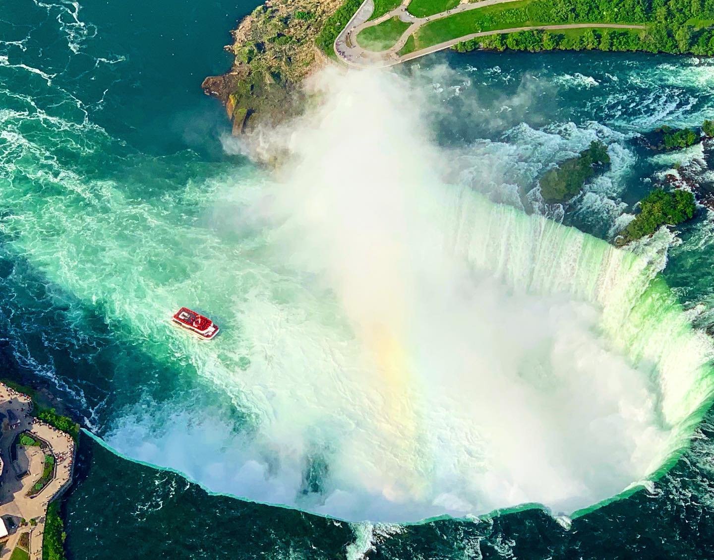 Horseshoe Falls rainbow aerial view showing the spectacular natural wonder