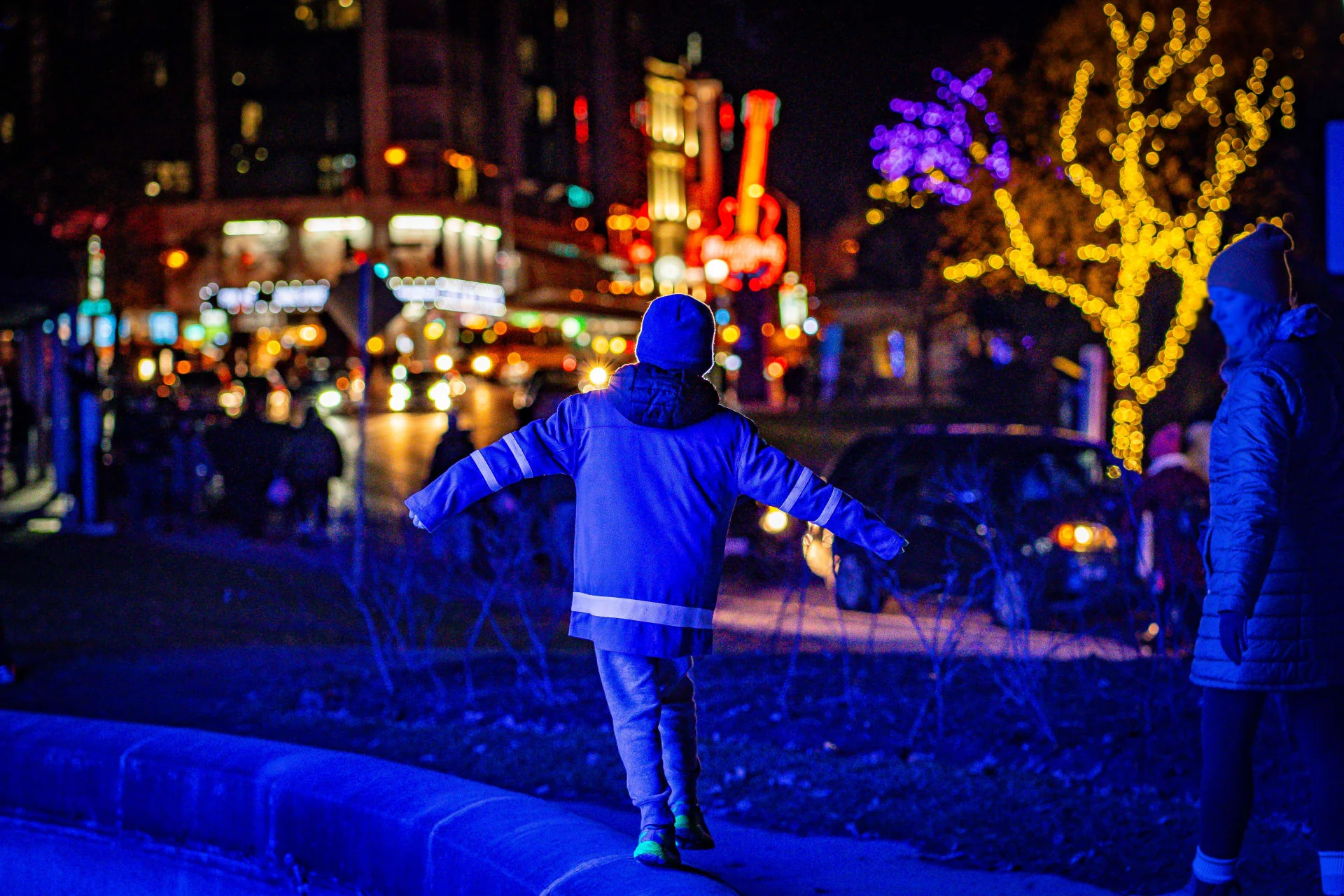 Crowds of visitors exploring spectacular light displays at Niagara Winter Festival of Lights