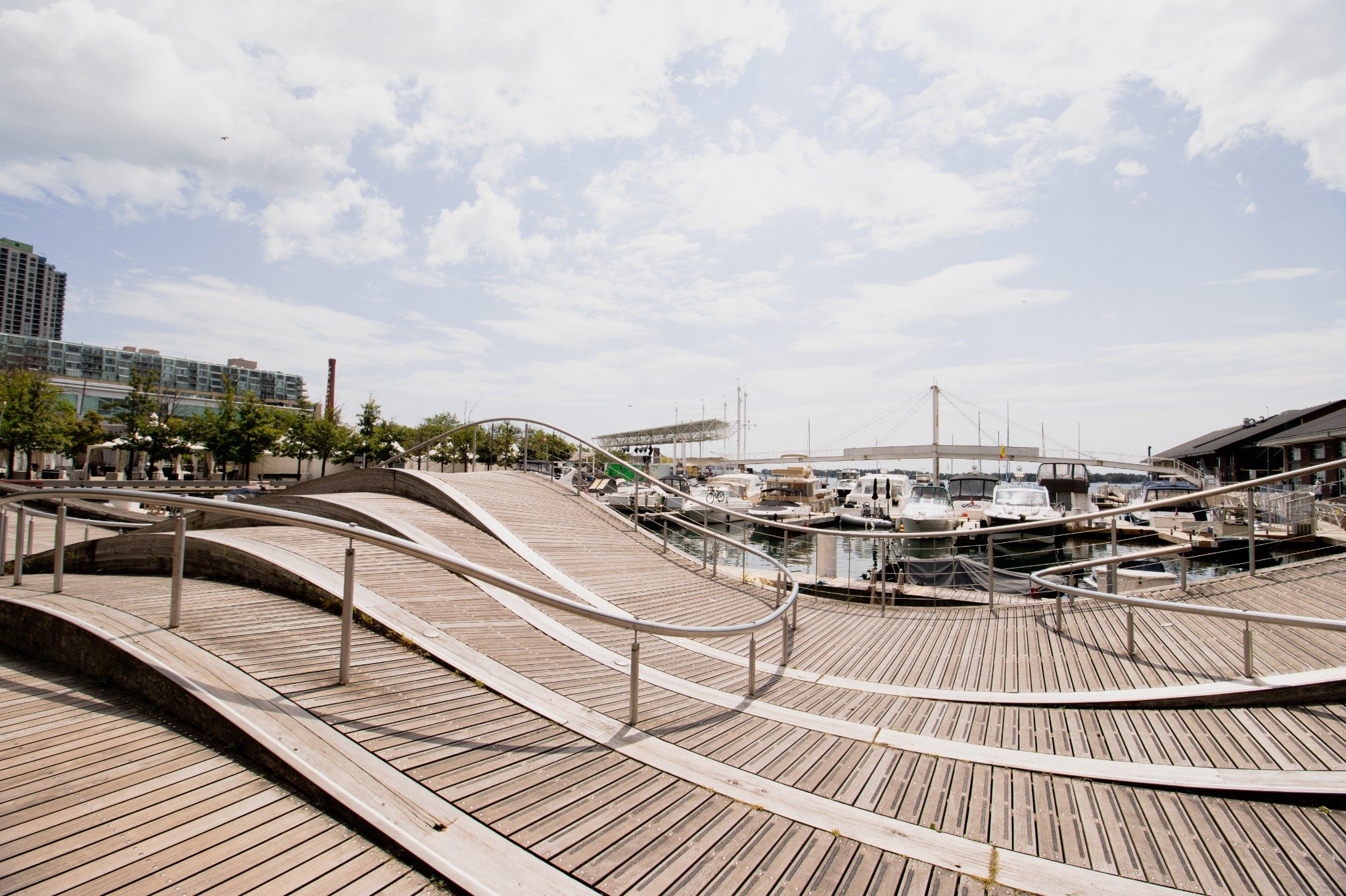 Toronto waterfront boardwalk with marina and boats