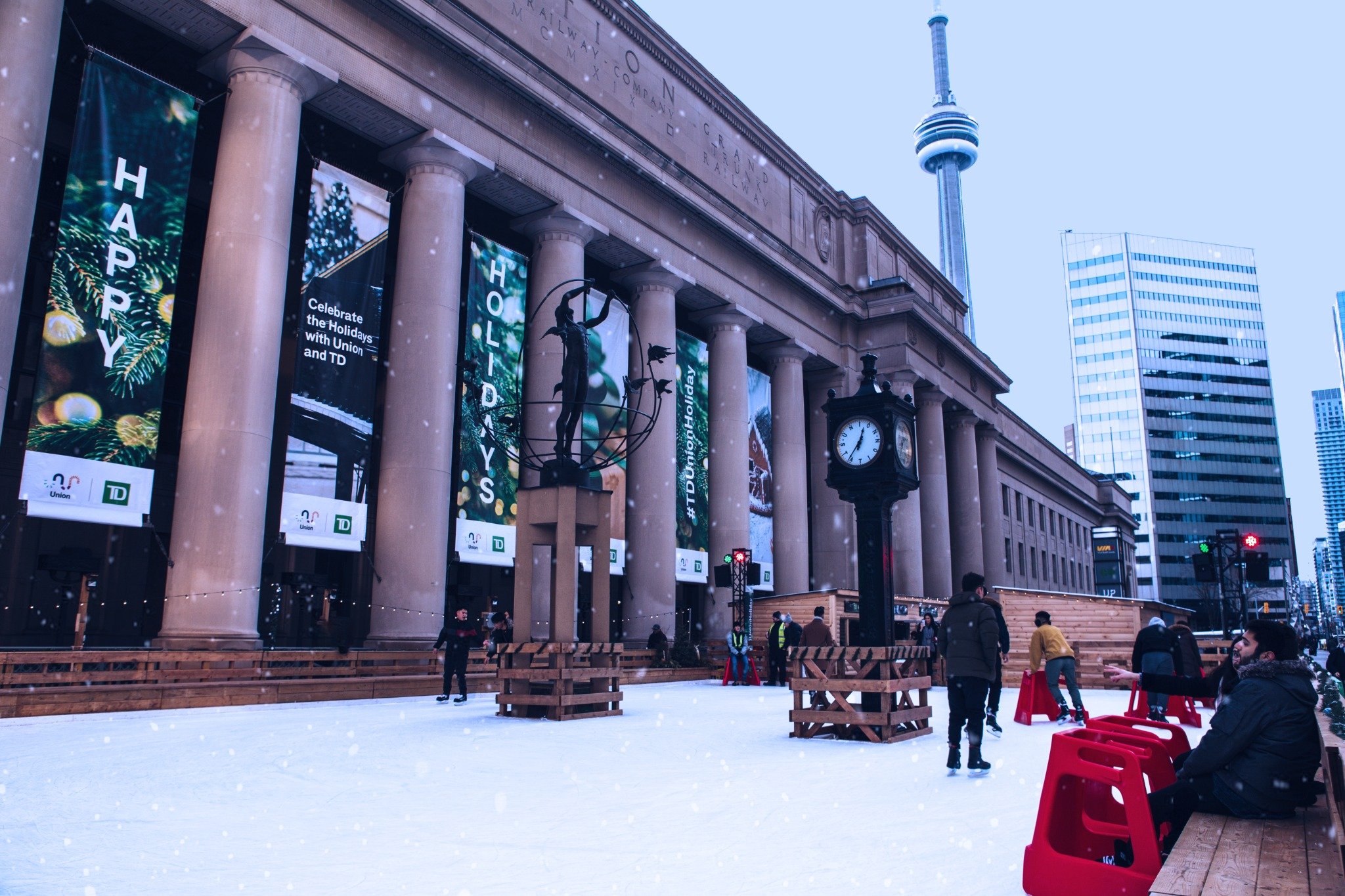 Union Station skating rink in winter with CN Tower in background
